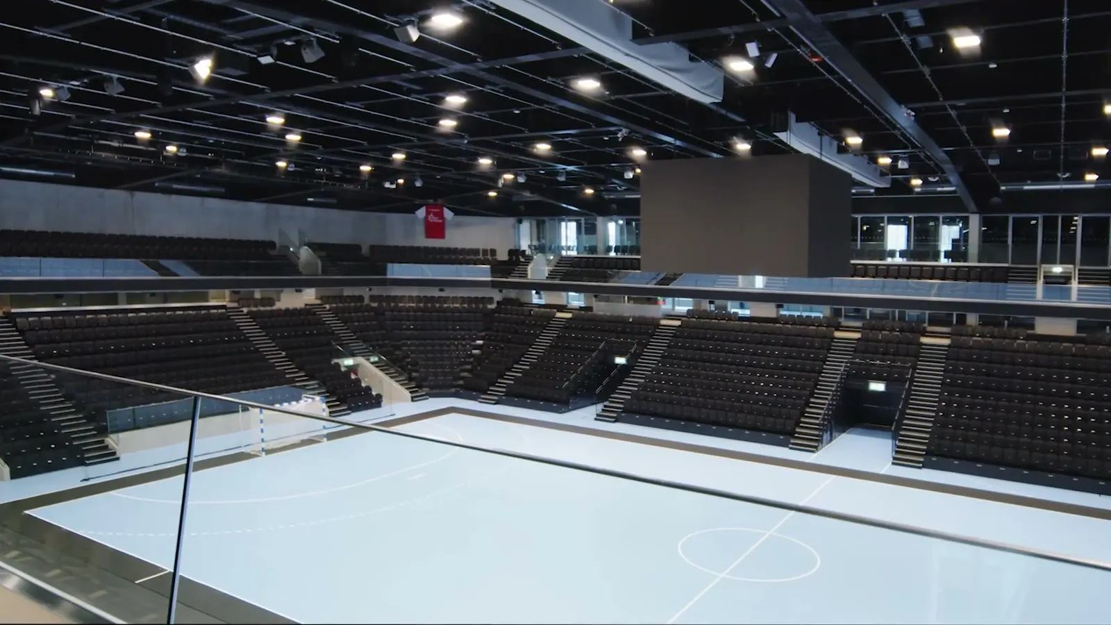 Empty ice rink and stands inside the Pilatus Arena in Kriens, still from the image film for Pfiffner AG